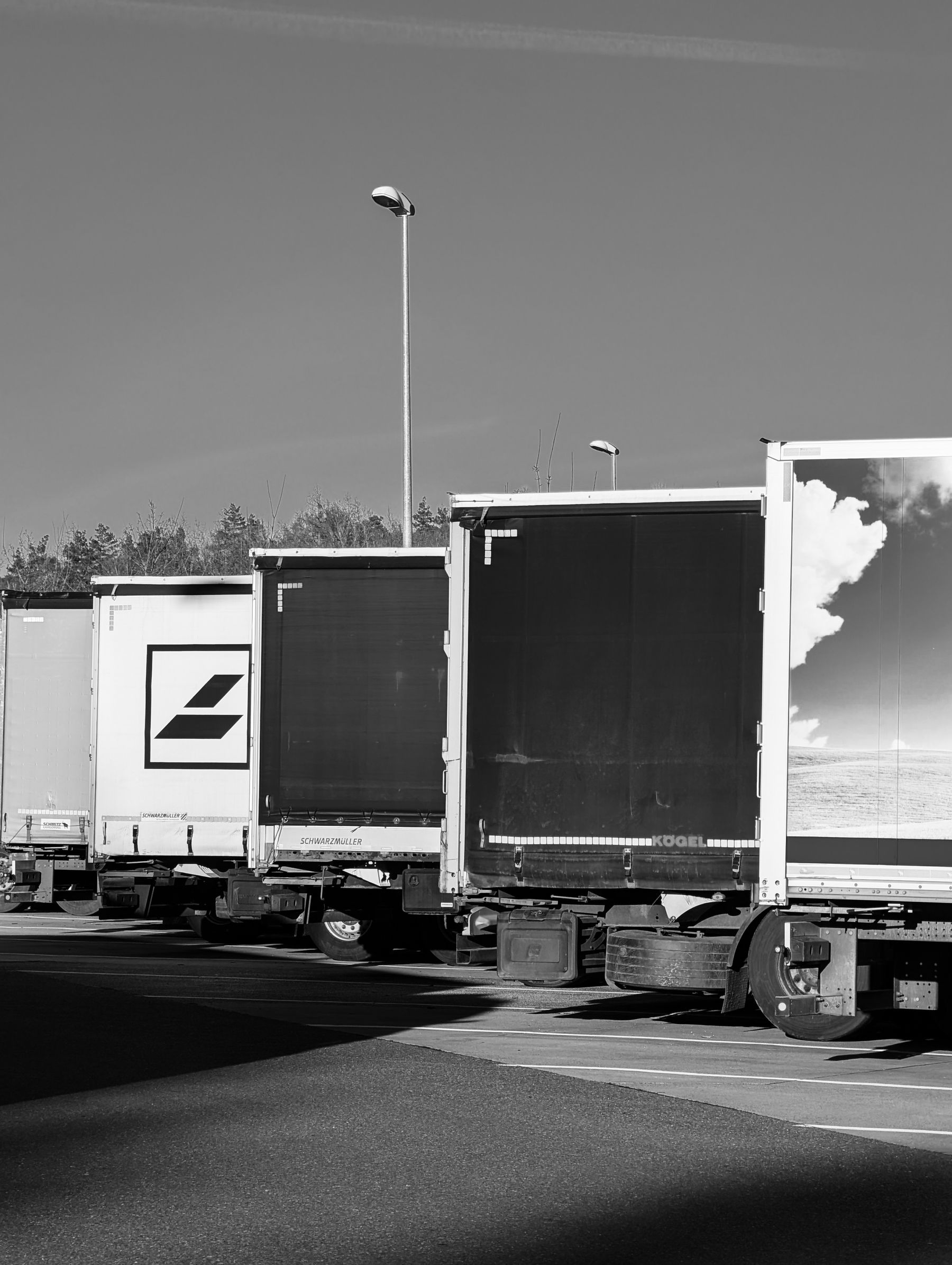 Commercial truck fleet lined up for service planning