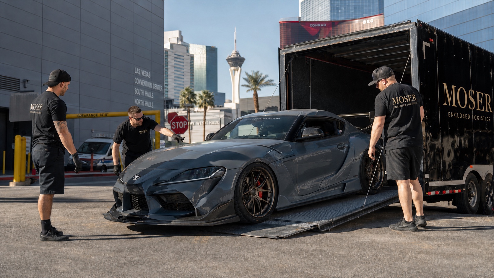 ELS Fleet Services crew unloading a modified Toyota GR Supra at the Las Vegas Convention Center